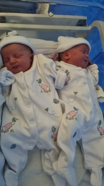 Lily & Ruby in Cot.webp
